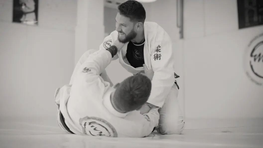 Two men practicing martial arts.