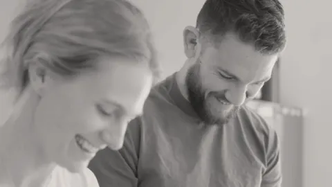 Man and his female partner sharing a smile